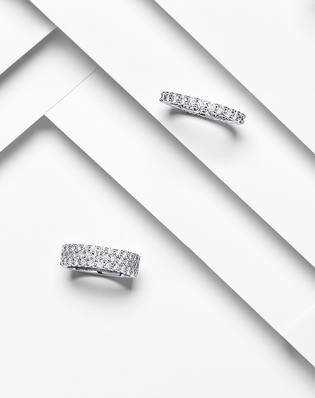 Birks diamond eternity bands on a white layered background.